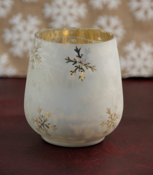 White glass tea light holder with snowflakes.