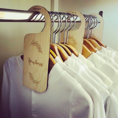 Wooden wardrobe dividers for baby's clothes. Leaves