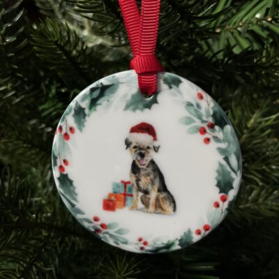 Hanging decoration of a Schnauzer wearing a Christmas hat