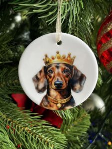 Charming ceramic Dachshund decoration featuring a Tan Dachshund wearing a golden crown.