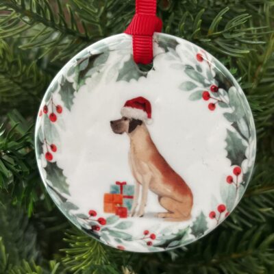 Ceramic hanging decoration. An image of a Great Dane wearing a Christmas hat.