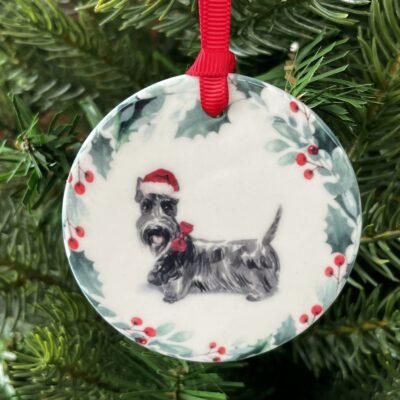 Hanging decoration of a Scottish Terrier wearing a Christmas hat