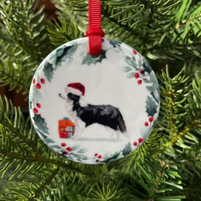 Border Collie hanging decoration. An image of a Border Collie wearing a Christmas hat