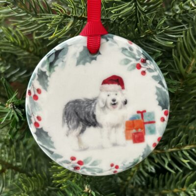 Hanging decoration of a Old English Sheepdog wearing a Christmas hat