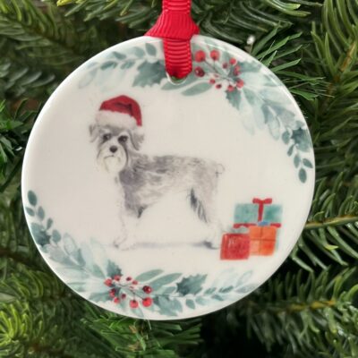 Hanging decoration of a Schnauzer wearing a Christmas hat