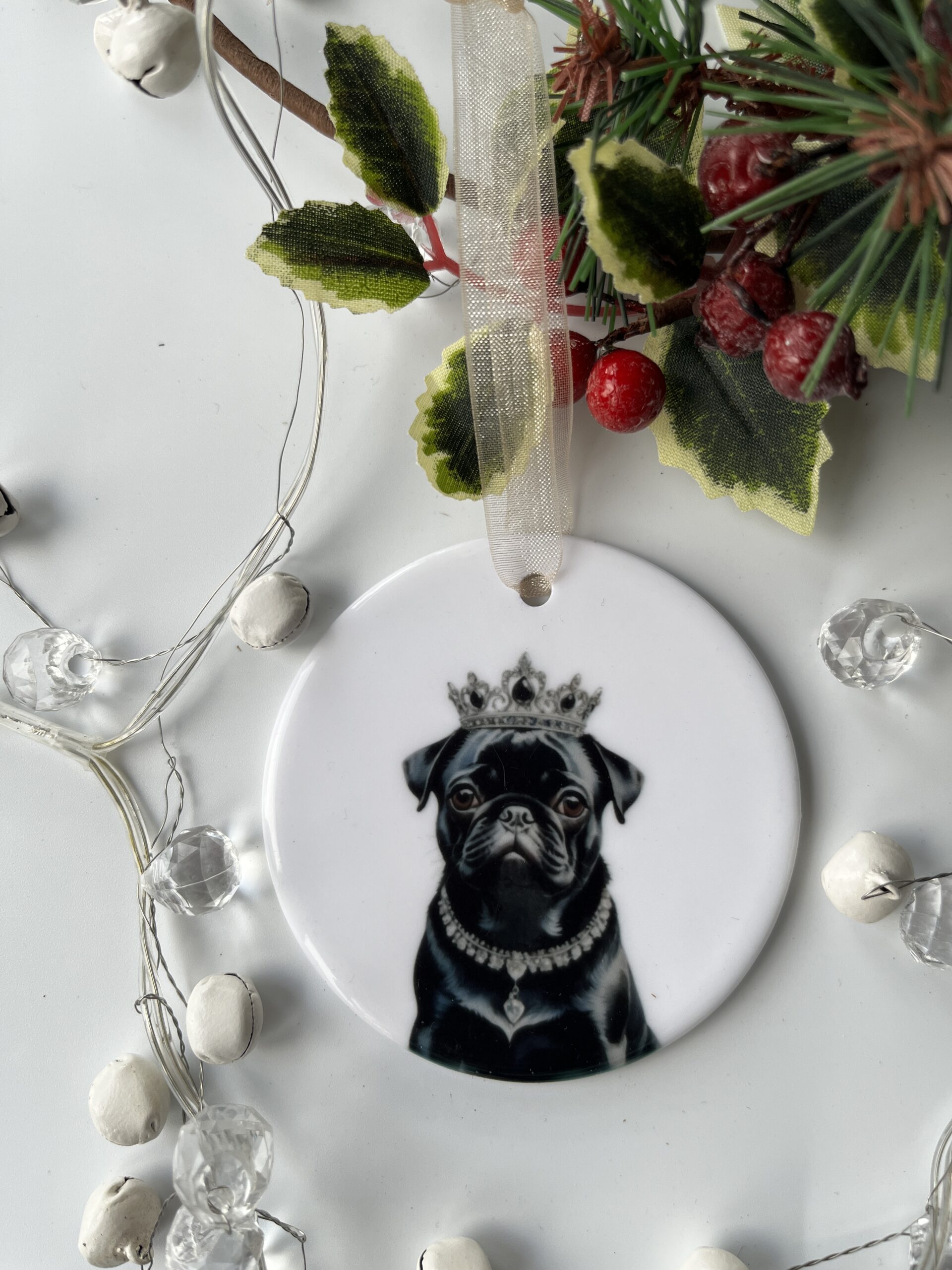 Lovely ceramic hanging decoration featuring a Black Pug wearing a silver crown
