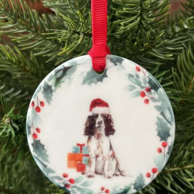 Ceramic hanging decoration with a watercolour image of a Liver and White Springer Spaniel on it.